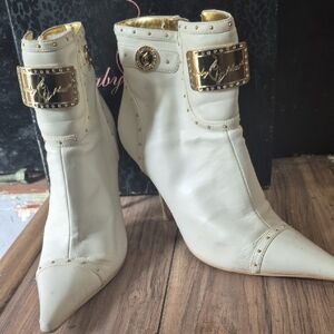 Baby Phat White Pointed-Toe Ankle Boots with Gold Plaques